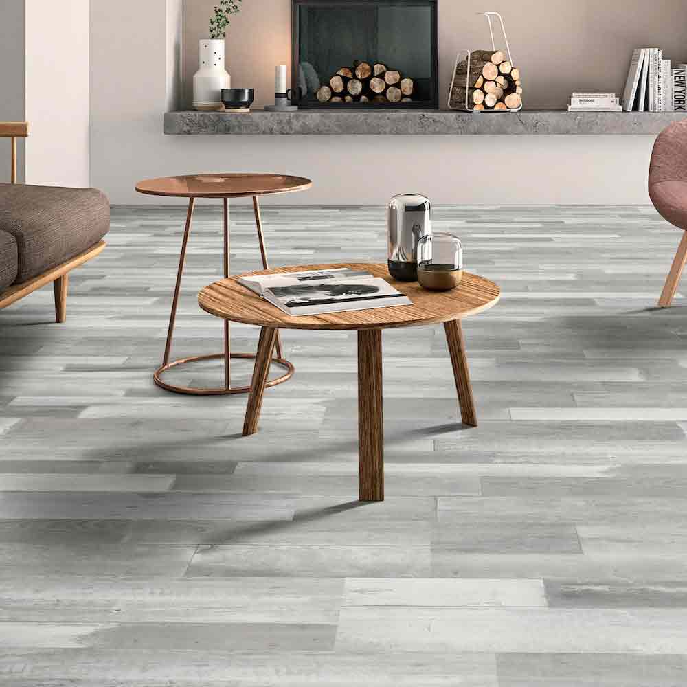 Charcoal gray flooring beside a fireplace